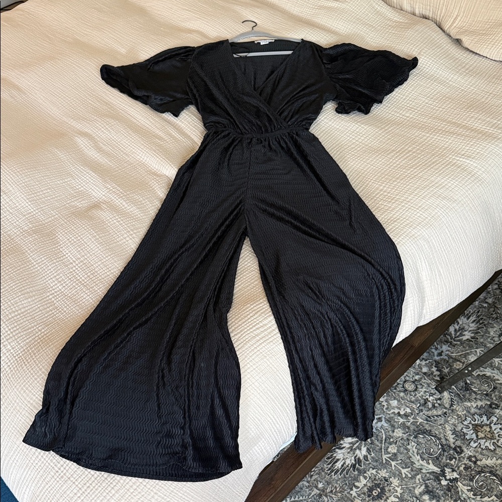 Baltic Born Black Wide-Leg Jumpsuit with Flutter Sleeves and V-Neck